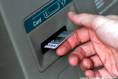 Britons cash in as ATM pays out double