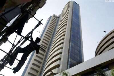 Sensex, Nifty end flat; autos up on extension of lower tax