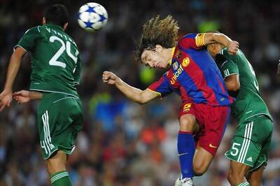 Barcelona defender Puyol signs 3-year extension