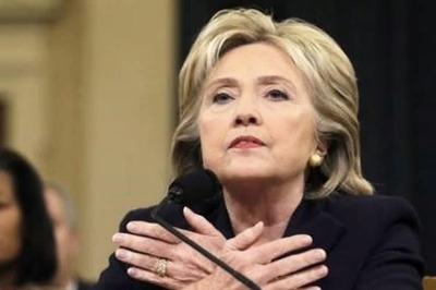 Hillary Clinton deflects harsh Republican criticism of her handling of 2012 Benghazi attack in a testy 11-hour hearing
