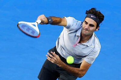 Federer, Serena fight Melbourne heat to advance