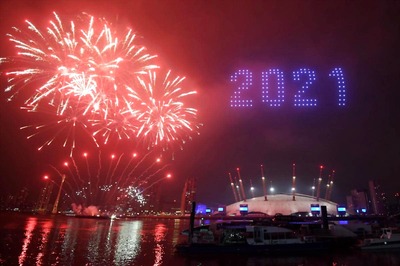 Fireworks Light Up Skies Over Eerily Deserted Landmarks as Bruised World Cautiously Enters 2021