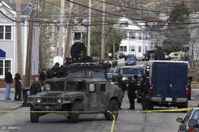 Shots fired in Massachusetts as police seek bomb suspect