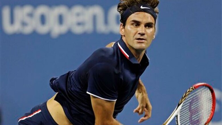 Federer eases past Young to reach second round