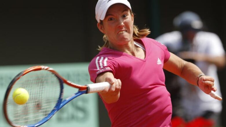 Henin wins 1st French Open game since '07