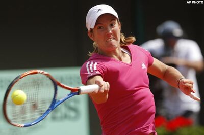 Henin wins 1st French Open game since '07