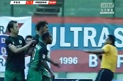 Indonesian footballer lands sucker punch on the referee