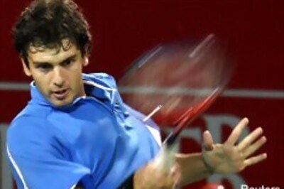 Robredo, Ancic advance into quarters