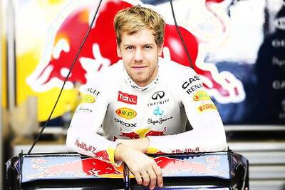 Wild ride keeps Vettel's F1 title hopes on track