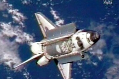 US space shuttle moves to avoid space junk