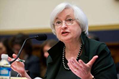 US Fed Reserve holds key rate steady, eyes two hikes later this year