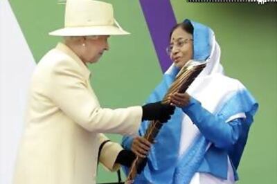 Patil receives Queen's Baton from Elizabeth II