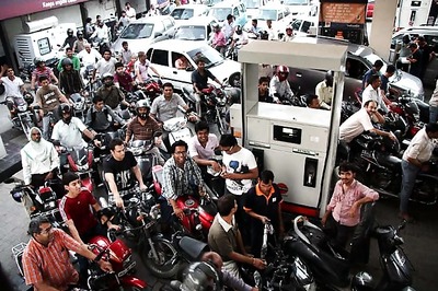 Kerala, U'khand cut tax on petrol after Congress diktat