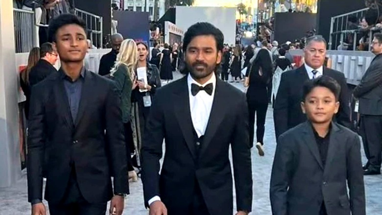 Dhanush Rocks A Mullet On The Gray Man Premiere Red Carpet But It's His Sons Who Steal The Show