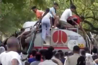 On Camera, Delhi Residents, Amid Water Scarcity, Chase And Climb Atop Tanker