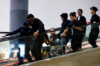 Chaotic Scenes as Suspects Wheeled Around Airport Where Kim Jong Un's Brother Was Killed
