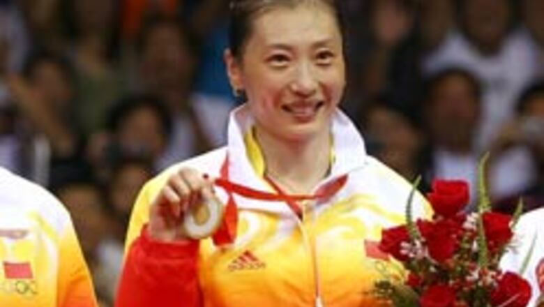Zhang upsets top seed, wins badminton gold