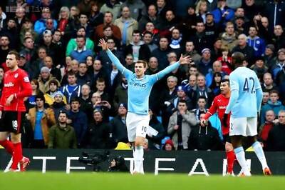Manchester City beat Cardiff 4-2 to pass 100-goal mark