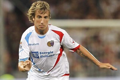 Milan end Tevez chase, sign Lopez from Catania
