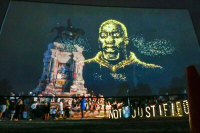 Racist Symbols No More: Floyd's Family Unveil His Hologram Transposed Over a Confederate General Statue