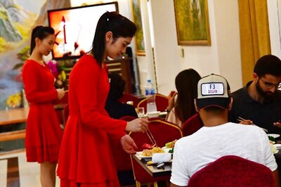 North Korean Rockettes Serve up Coca-Cola in Dubai