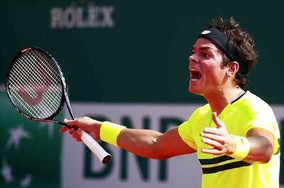 Milos Raonic upsets Nikolay Davydenko in Madrid