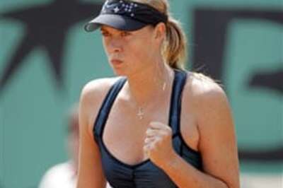 Henin, Sharapova storm into semis