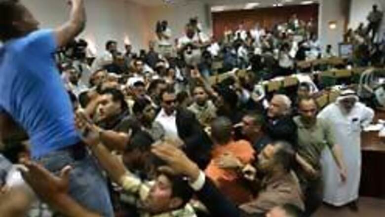 Workers storm Palestinian Parliament