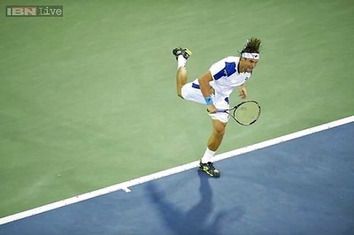 David Ferrer, Stanislas Wawrinka reach quarter-finals in Paris