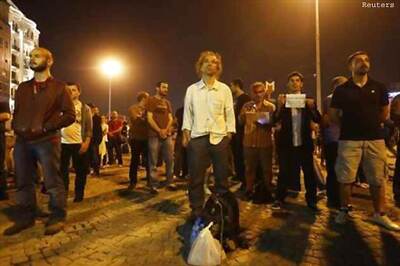 Dozens arrested in Turkey, silent protester goes viral